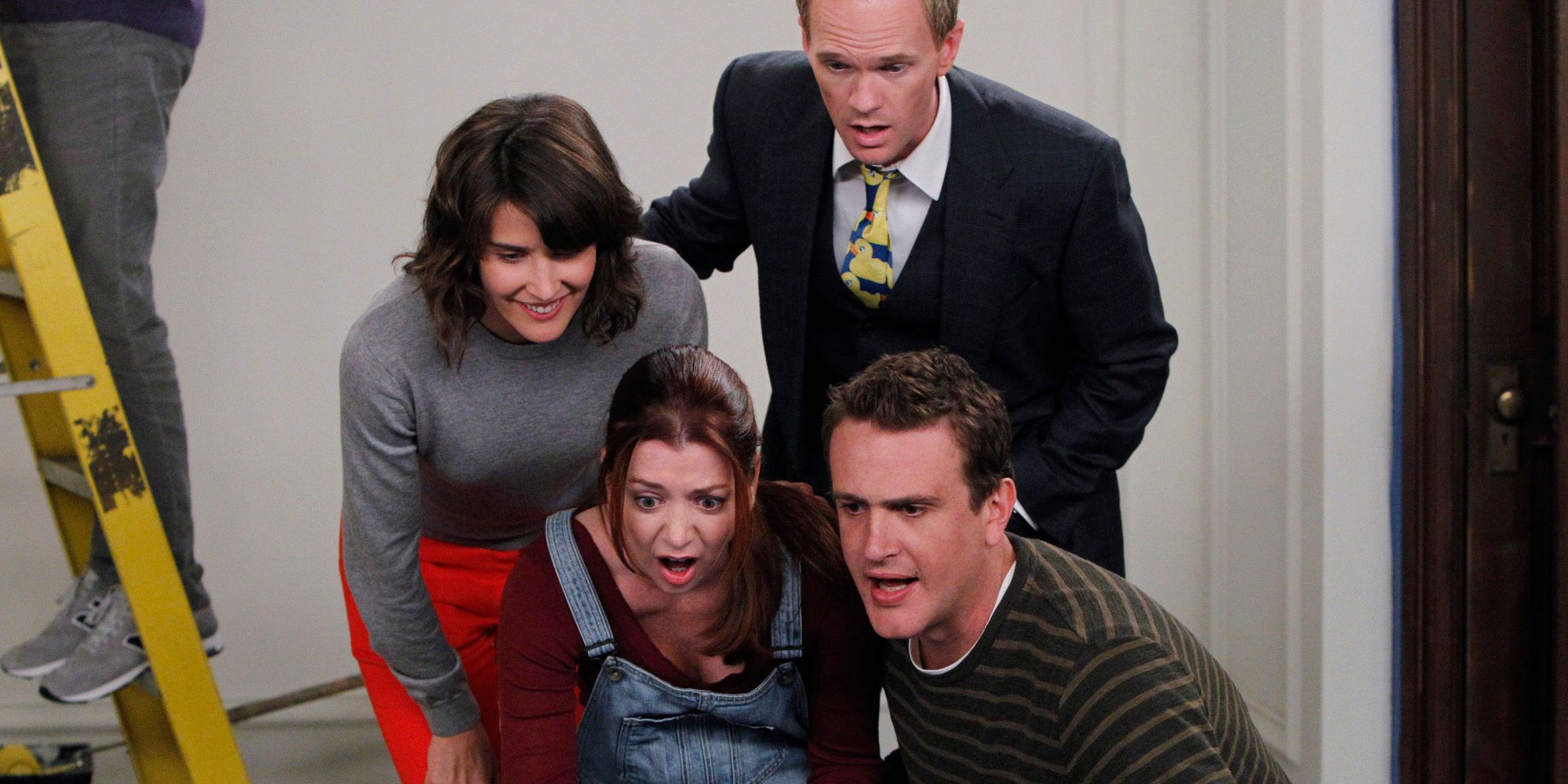 Robin, Lilly, Barney, and Marshall look shocked while looking up Ted's date in How I Met Your Mother 