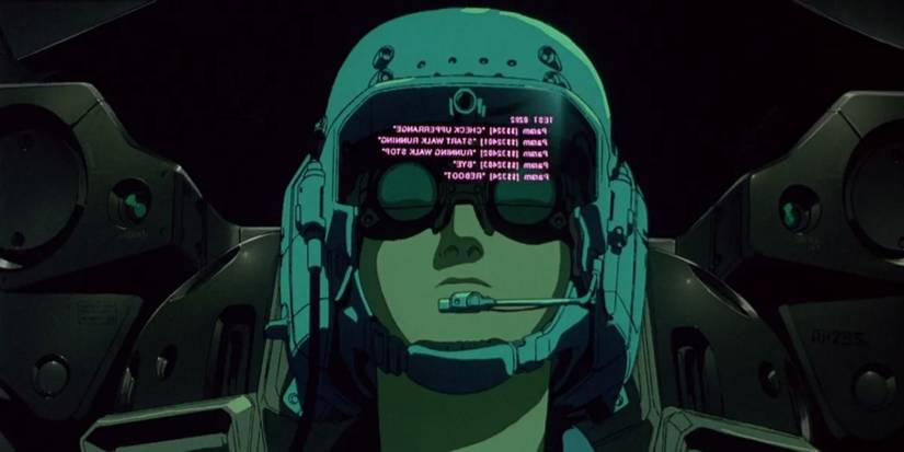 A pilot with instructions reflected on his helmet in Patlabor 2 C