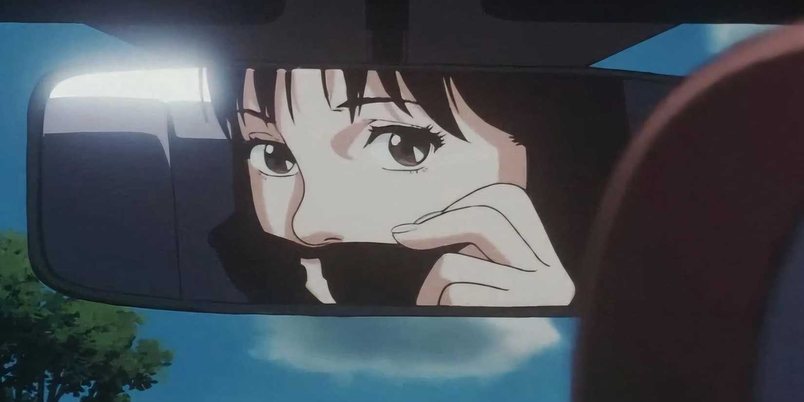 Perfect Blue - a woman peeks above her sunglasses in a car's rearview mirror