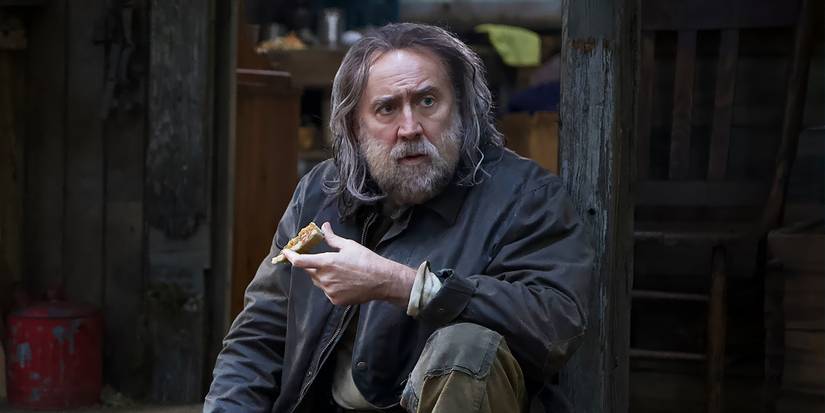 Nicolas Cage as Rob looking at something in Pig