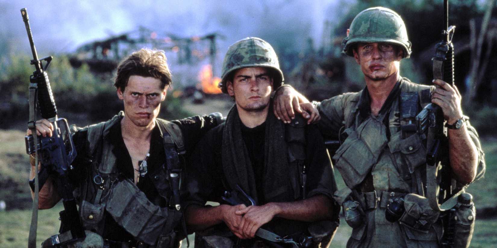 Three soldiers looking at the camera in Platoon
