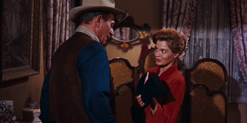 John T. Chance (John Wayne) speaks with Feathers (Angie Dickinson) in 'Rio Bravo'