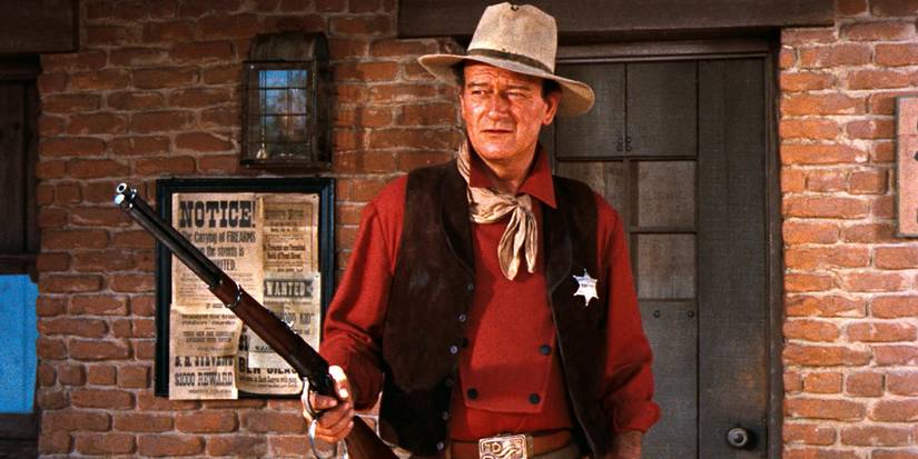 John Wayne as John T. Chance with his rifle in 'Rio Bravo'.