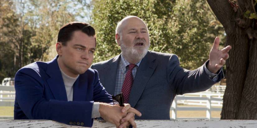 Leonardo DiCaprio as Jordan and Rob Reiner as Max talking while pointing in The Wolf of Wall Street.