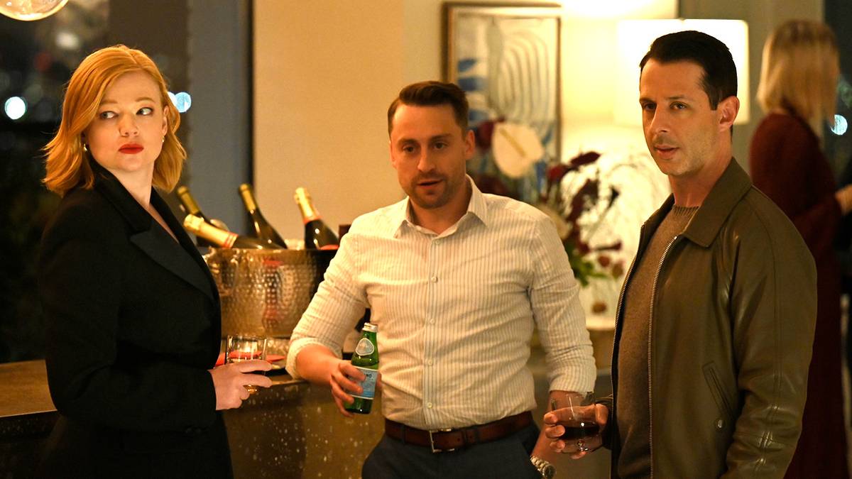 Sarah Snook, Kieran Culkin, and Jeremy Strong at a party holding drinks in Succession Season 4.