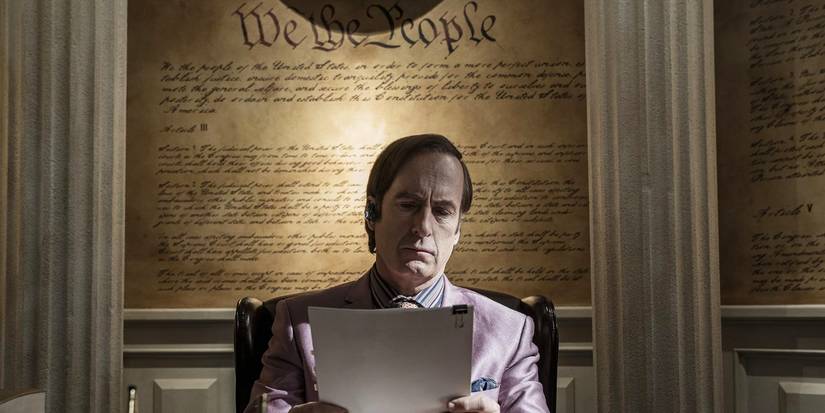 Saul Goodman (Bob Odenkirk) sitting in his iconic office in 'Better Call Saul.'