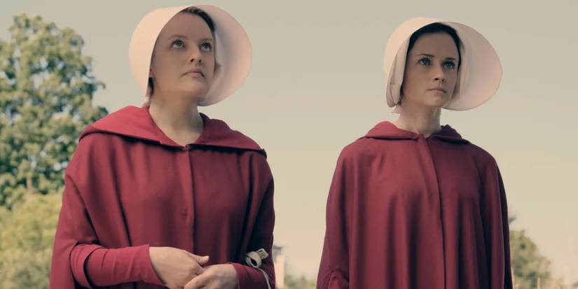 Elisabeth Moss as June and Alexis Bledel as Emily in The Handmaid's Tale