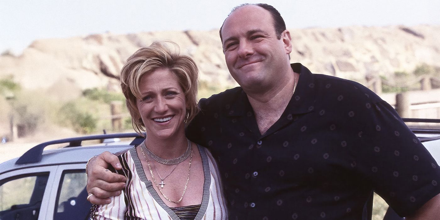 Tony with his arm around Carmela as they both smile in 
