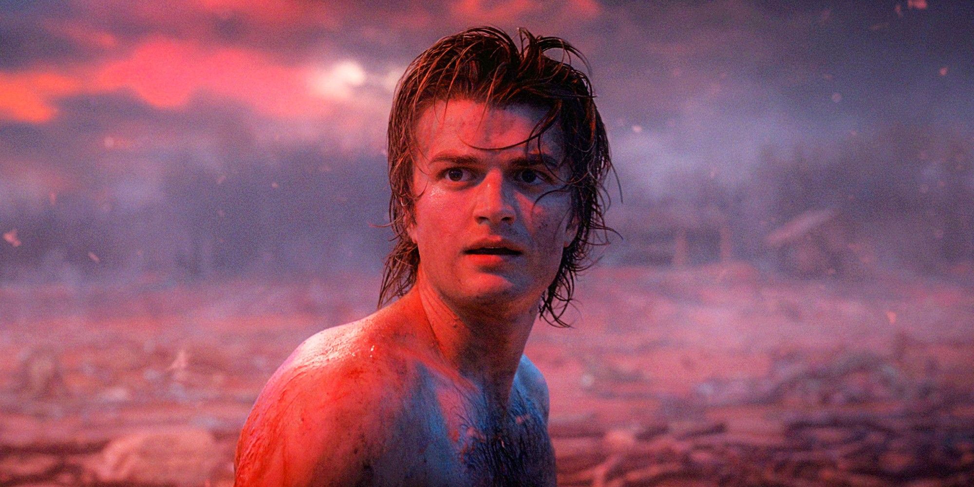 Joe Keery as Steve Harrington jumping into the lake in Stranger Things Season 4