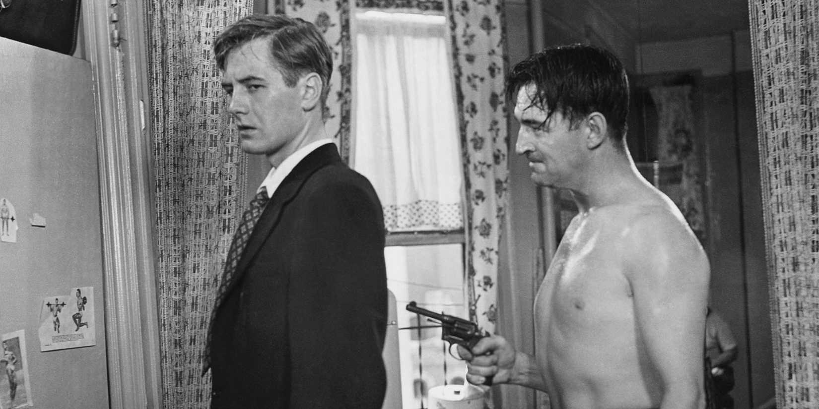 Ted de Corsia standing behind Don Taylor pointing a gun at him in The Naked City (1948)