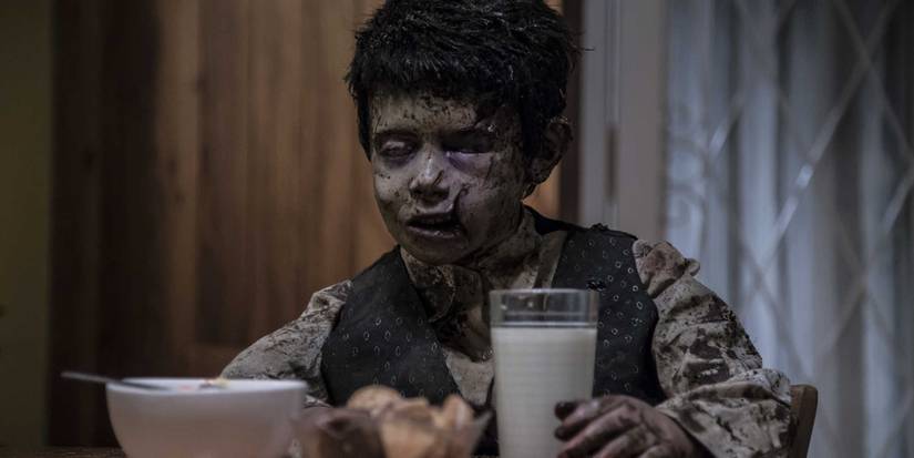 A corpse of a little boy mysteriously shows up at the table in 'Terrified' (2017)