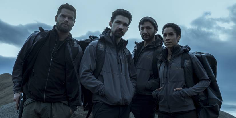 The crew of the Rocinante stand rugged up in a cold and bleak setting in 'The Expanse' (2015-2022).