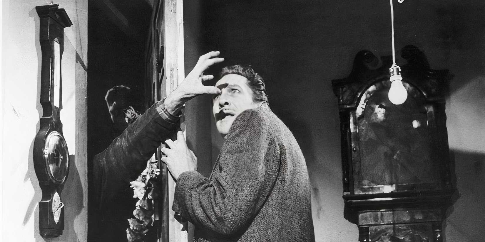 Vincent Price tries to keep an invader out in The Last Man on Earth.