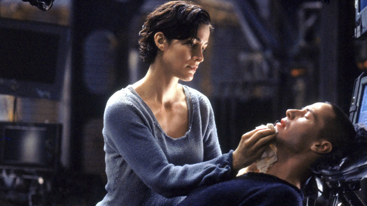 Trinity treats Neo's wounds in The Matrix