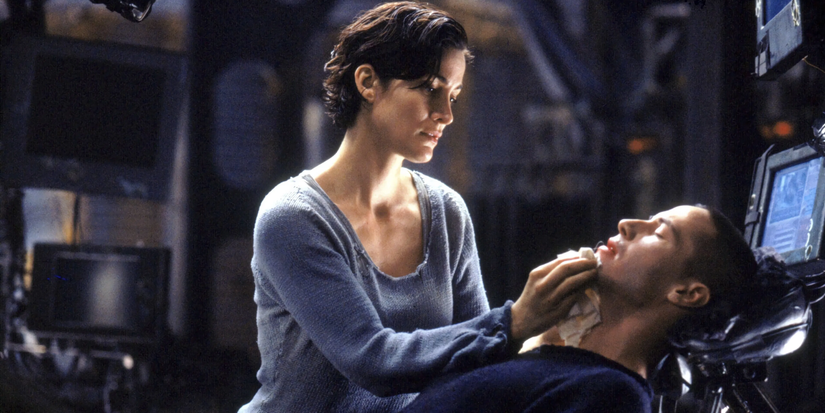 Trinity treats Neo's wounds in The Matrix