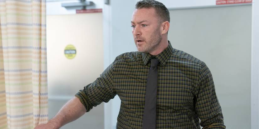 Michael Ormewood (Jake McLaughlin) in a plaid shirt and tie in 'Will Trent.'