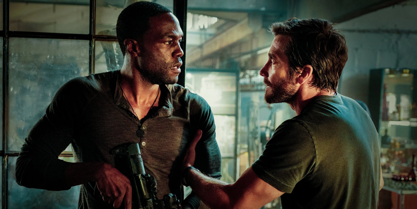 yahya abdul mateen and jake gyllenhaal stares at each other in ambulance