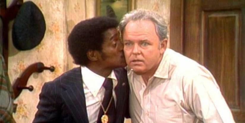 Sammy Davis Jr. kisses Archie Bunker on the cheek in All in the Family.