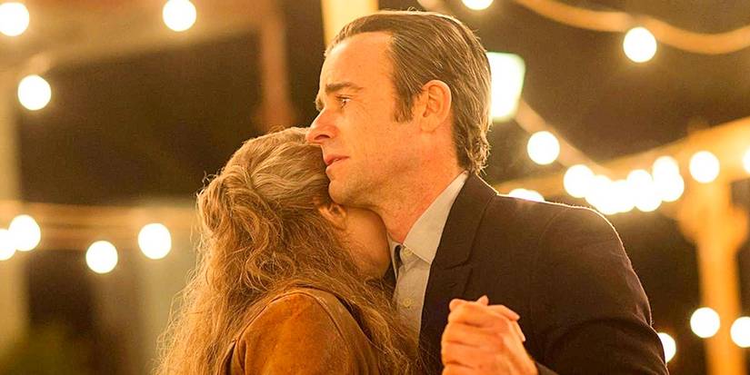 Justin Theroux as older Kevin Garvey and Carrie Coon as older Nora Durst slow-dancing at a wedding in the series finale of The Leftovers