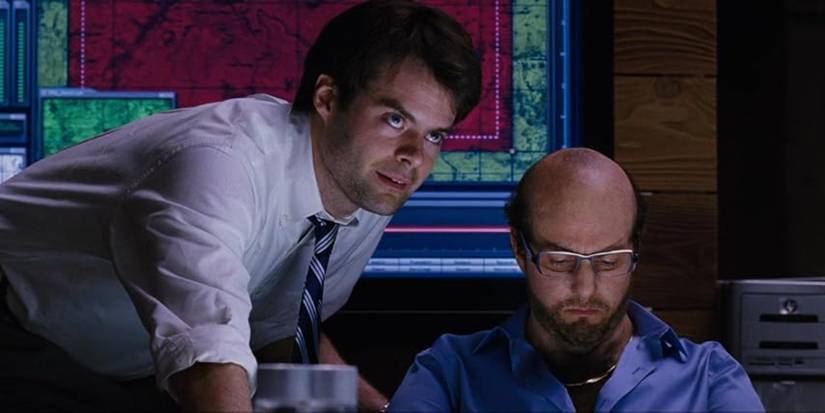 Bill Hader leaning over Tom Cruise and talking to someone in front of them, off screen, in Tropic Thunder