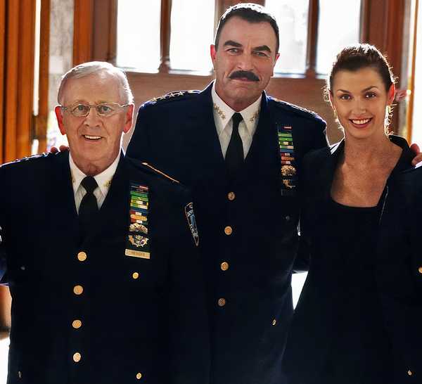 The cast of Blue Bloods lines up in uniform