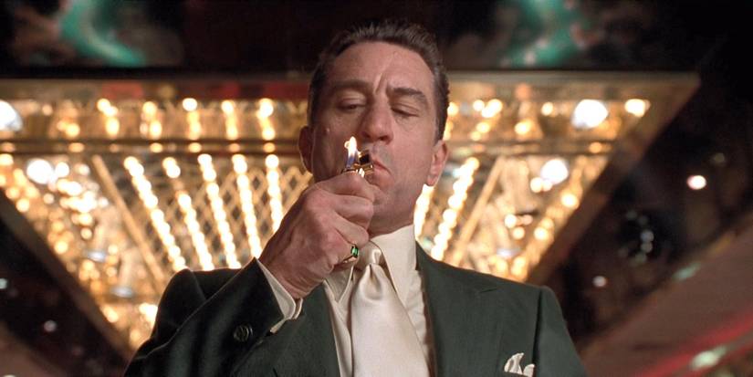 Robert De Niro lighting a cigar in Casino