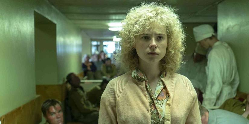 Lyudmilla (Jessie Buckley) walks down a hallway in 'Chernobyl.'