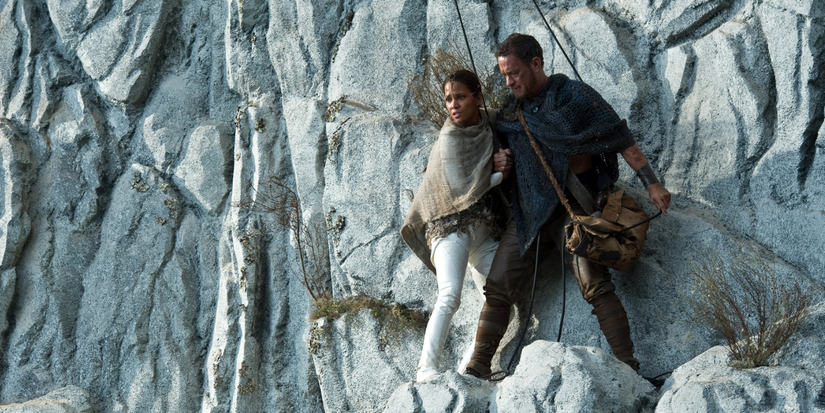 tom hanks and halle berry stands on the side of a white cliff