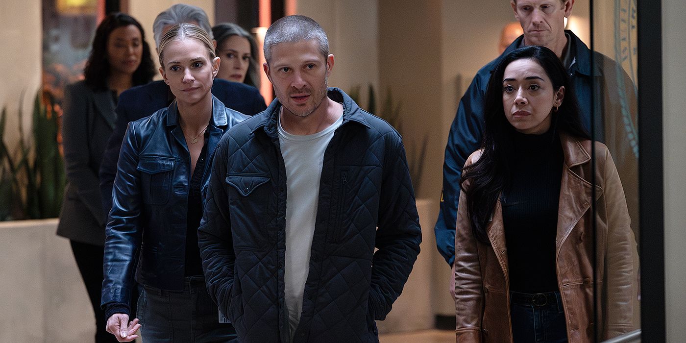 Voit (Zach Gilford) walking with J.J. (A.J. Cook) and Dr. Ochoa (Aimee Garcia) through the BAU in Criminal Minds.