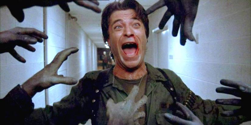 Zombie hands reaching for a screaming man in Day of the Dead - 1985