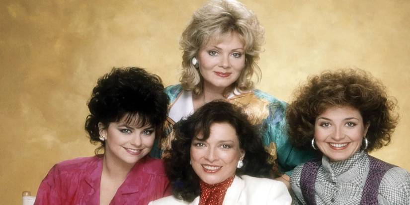 The cast of Designing Women smile while posing together for a photo.