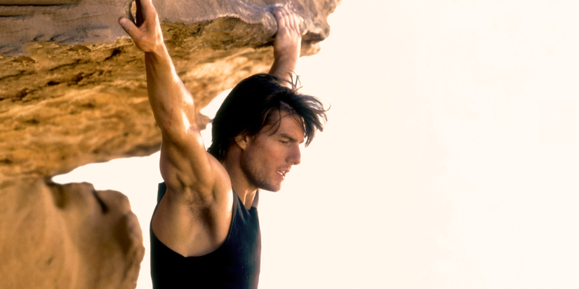 ethan hunt hanging from a mountain in mission impossible 2