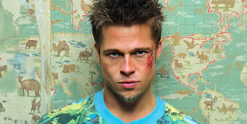 Brad Pitt as Tyler Durden with a scratch on his cheek looking at the camera in Fight Club.