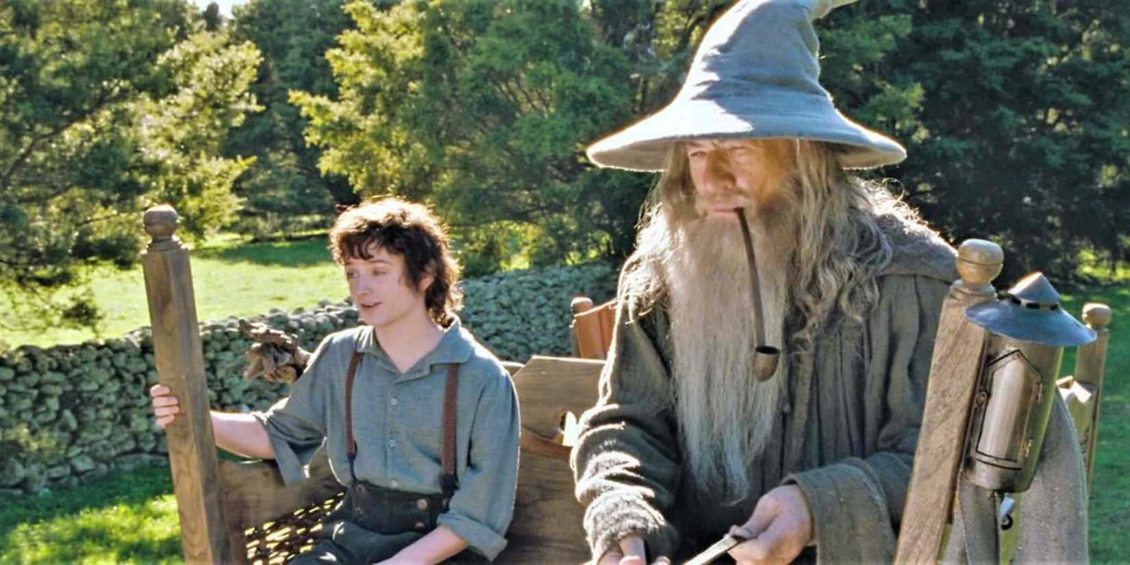 Frodo and Gandalf in a cart in the Shire in 'The Lord of the Rings: The Fellowship of the Ring' (2001)