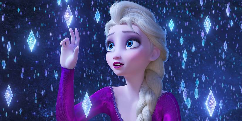 Elsa, voiced by Idina Menzel, reaches out to touch a diamond-shaped snow crystal in Frozen 2, 2019.