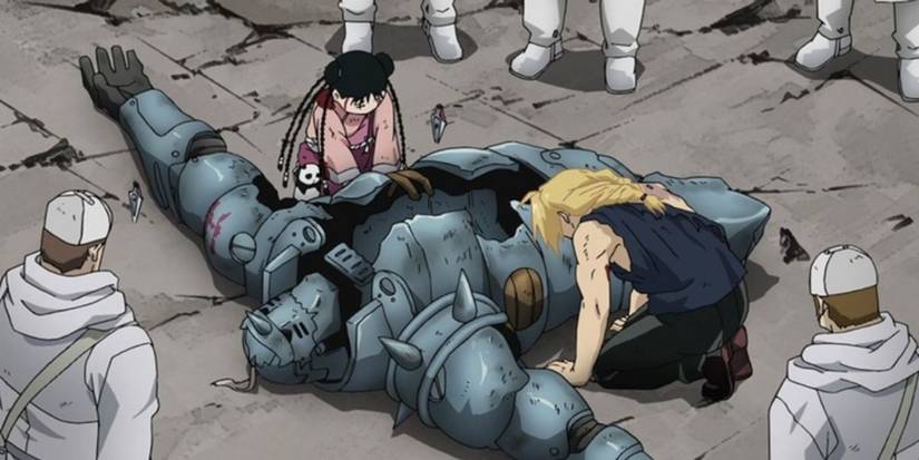 Ed leaning over Al's broken body in Fullmetal Alchemist: Brotherhood.