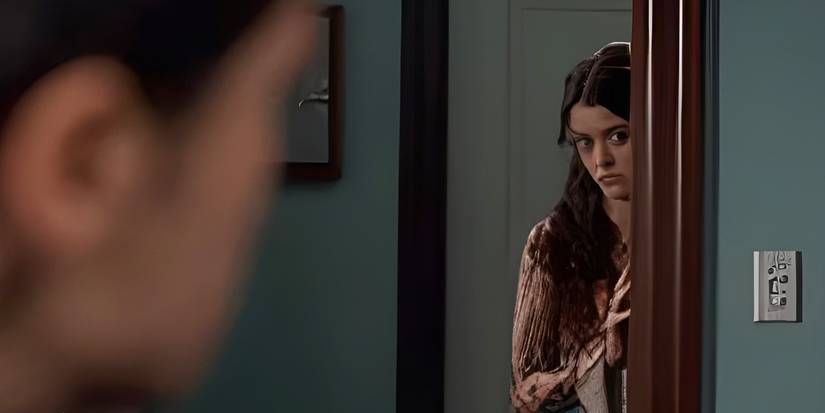 Max (Sara Waisglass) looking in on Marcus (Felix Mallard) from the doorway in Ginny & Georgia Season 3.