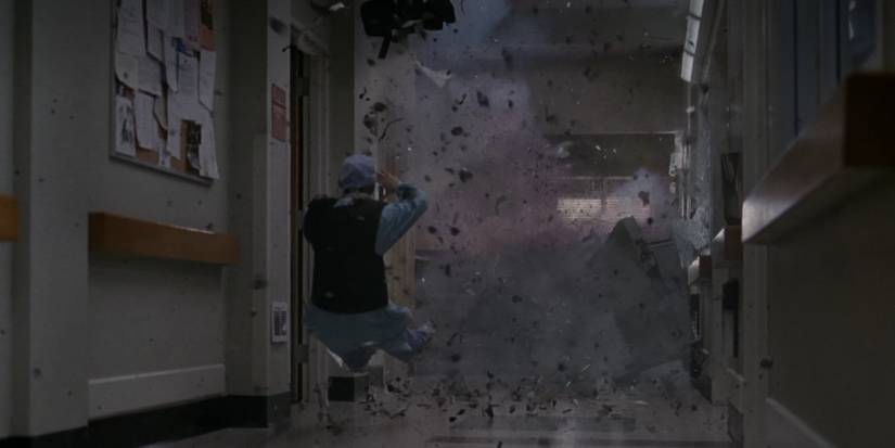 Meredith Grey (Ellen Pompeo) being launched back by a bomb in Grey's Anatomy