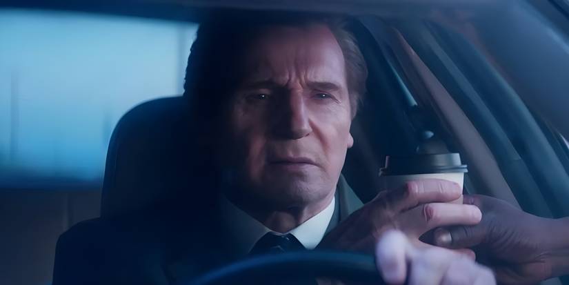 A hand reaches in to give Frank Drebin Jr. (Liam Neeson) a coffee while he's driving in The Naked Gun.