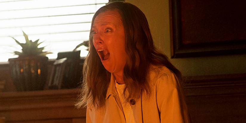 Toni Collette as Annie Graham with her mouth open in fear in Hereditary