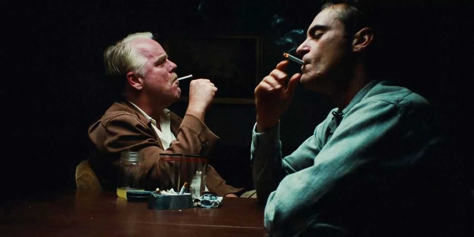 Joaquin Phoenix and Philip Seymour Hoffman smoke cigarettes together in Paul Thomas Anderson's 'The Master'