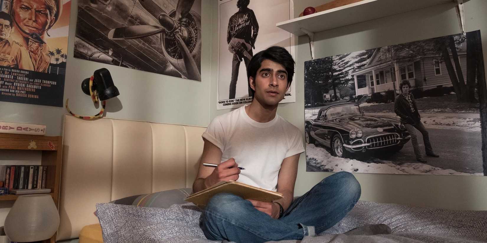 Javed sitting on his bed in 'Blinded by the Light'