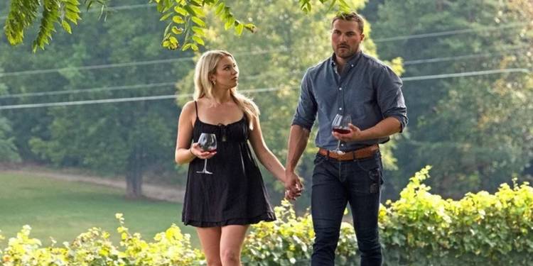 Calah and Steven hold hands and glasses of wine on 'Joe Millionaire: For Richer or Poorer'