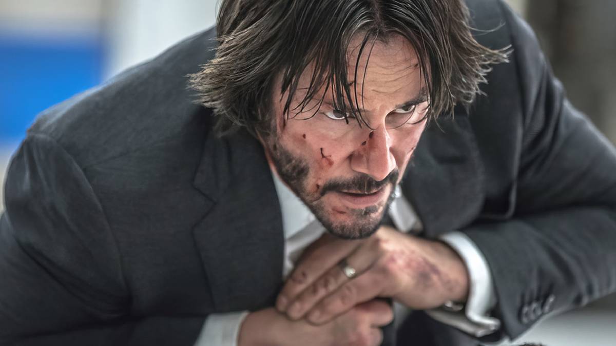 Keanu Reeves on the ground during a fight in John Wick Chapter 2
