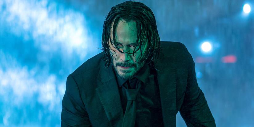Keanu Reeves in the rain as John Wick in John Wick 4