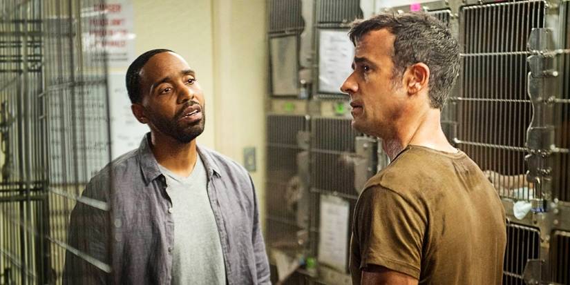 John Murphy and Kevin Garvey having a conversation inside the dog kennel in The Leftovers Season 2.