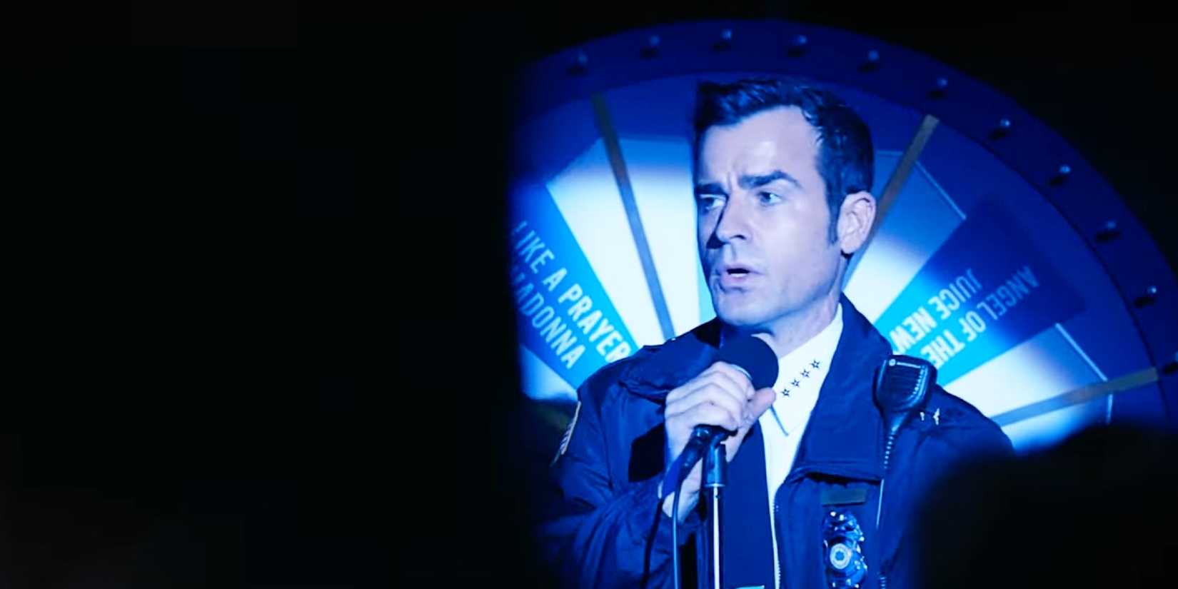 Justin Theroux as Kevin Garvey singing karaoke in the afterlife in front of a karaoke wheel in The Leftovers' Season 2 finale