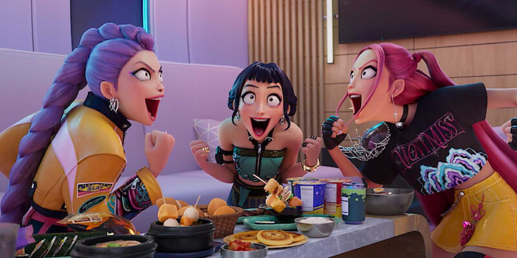The three main characters yell excitedly over a table of snacks in KPop Demon Hunters 2025.