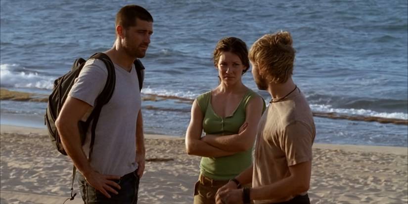 Jack Shephard (Matthew Fox) and Kate Austen (Evangeline Lilly) talking to Charlie Pace (Dominic Monaghan) on a beach in Lost.