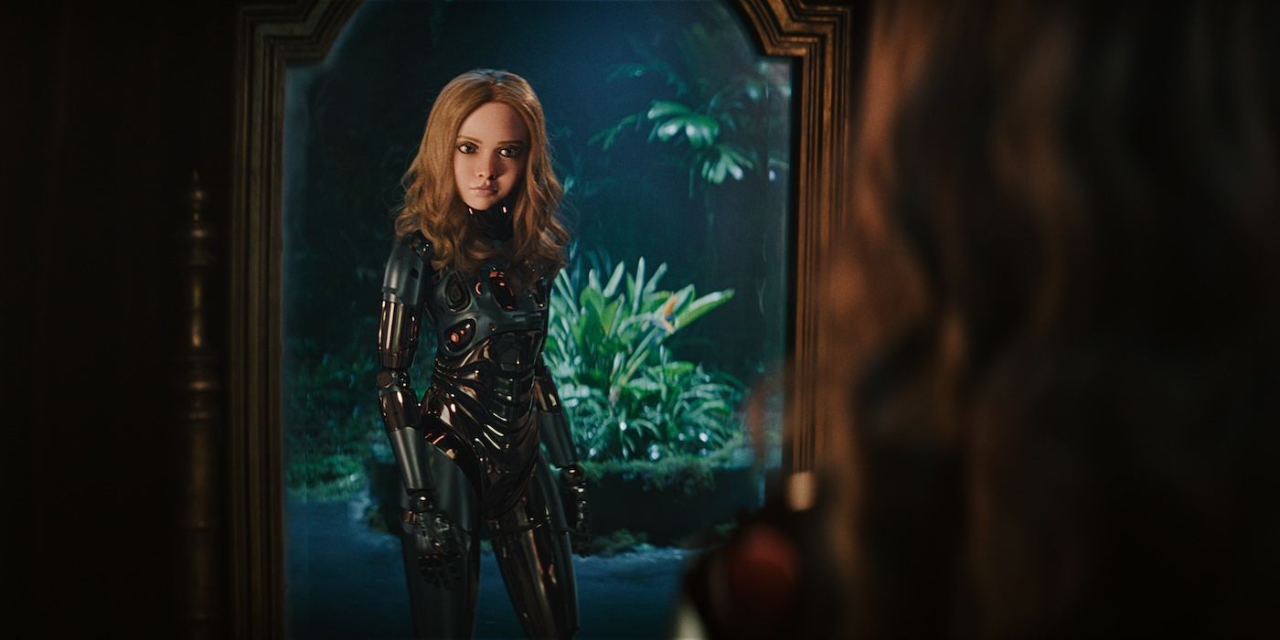 Amie Donald as M3GAN looking into a mirror in M3GAN  2.0